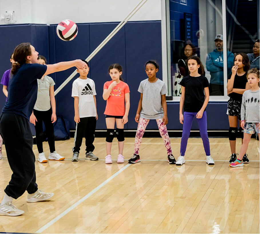 learn-to-play-volleyball-coach-with-group (1)